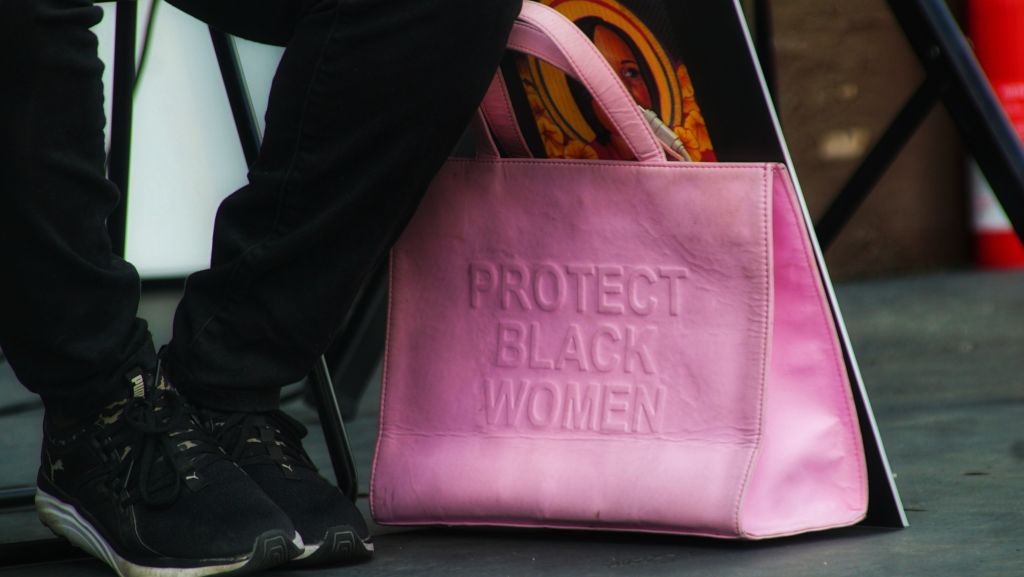 Pink purse with text that reads: Protect Black Women